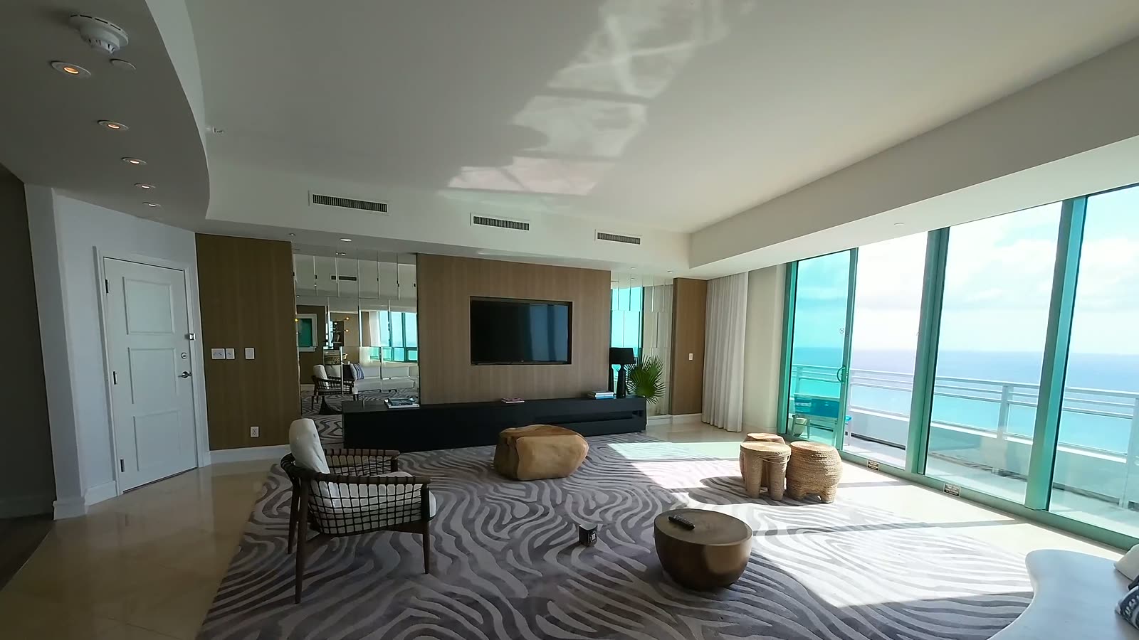 Interior living space with floor-to-ceiling Gulf views